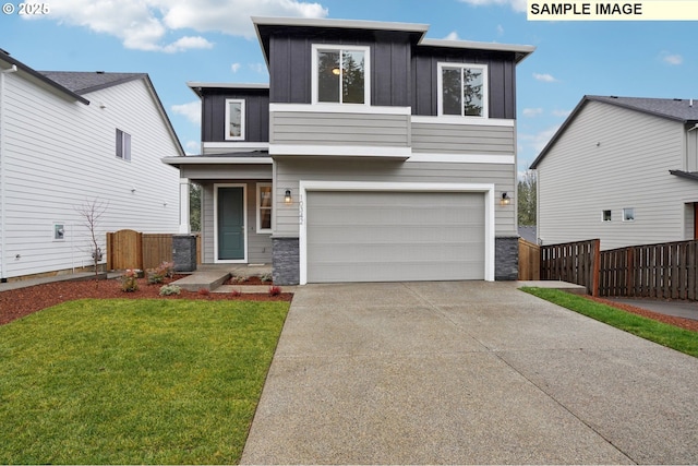 view of front facade featuring a garage and a front yard