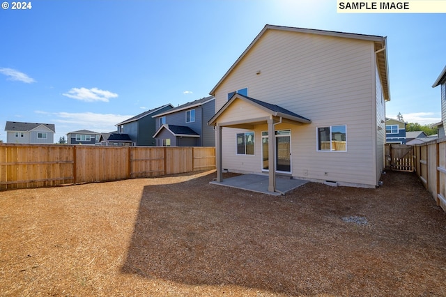 rear view of property with a patio area