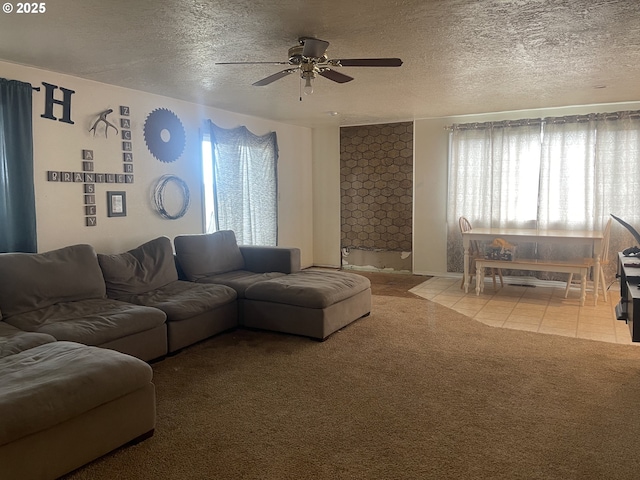 414 NW 5th St, Willamina, OR 97396 - living area featuring a ceiling fan, light carpet, a textured ceiling, and light tile patterned flooring