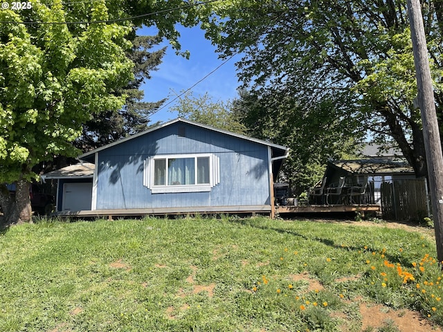 414 NW 5th St, Willamina, OR 97396 - view of front of home featuring a front yard and a wooden deck