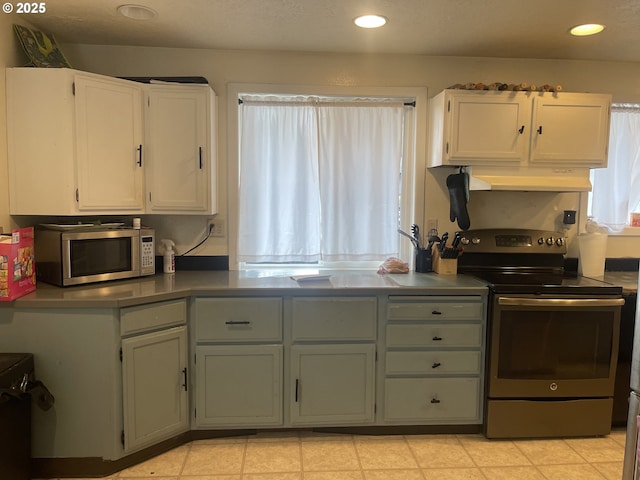414 NW 5th St, Willamina, OR 97396 - kitchen with appliances with stainless steel finishes, under cabinet range hood, white cabinets, and recessed lighting