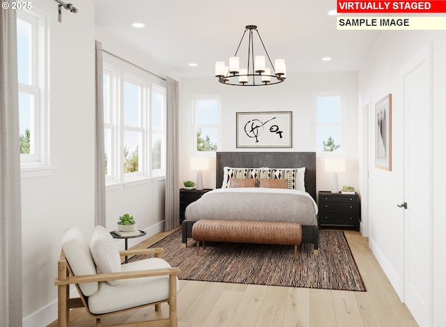 6511 NW Olympic Ln Unit L 61, Camas, WA 98607 - bedroom with a chandelier, baseboards, recessed lighting, and wood finished floors