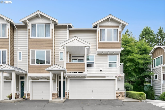 8710 SW 147th Ter Unit 104, Beaverton, OR 97007 - multi unit property with stone siding, an attached garage, and driveway