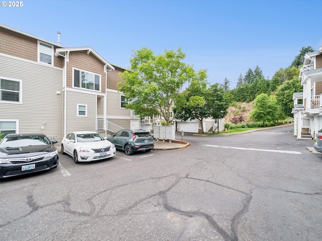 8710 SW 147th Ter Unit 104, Beaverton, OR 97007 - view of asphalt road featuring curbs