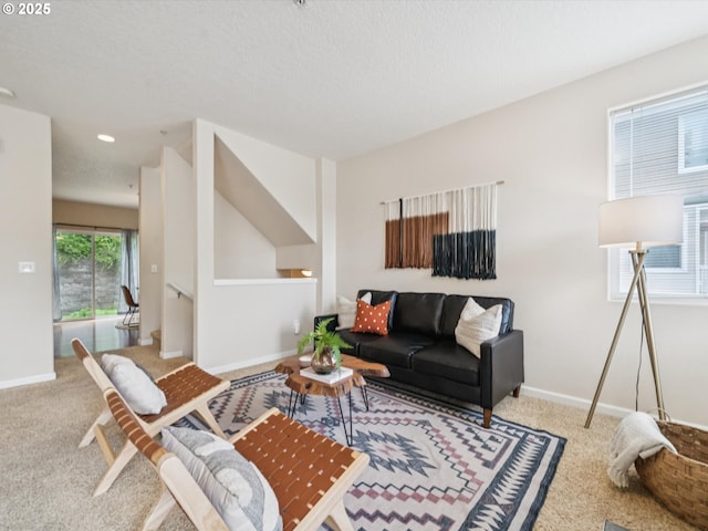 8710 SW 147th Ter Unit 104, Beaverton, OR 97007 - carpeted living area featuring baseboards