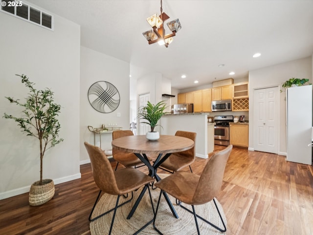 8710 SW 147th Ter Unit 104, Beaverton, OR 97007 - dining area featuring light wood-style floors, recessed lighting, and a chandelier