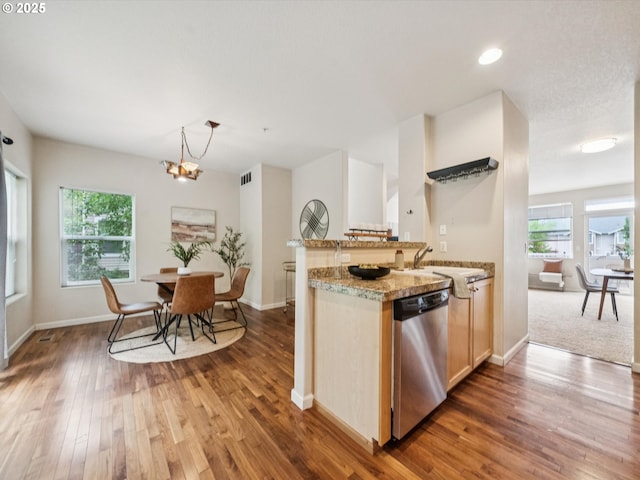 8710 SW 147th Ter Unit 104, Beaverton, OR 97007 - kitchen with dishwasher, wood finished floors, a chandelier, recessed lighting, and light brown cabinets