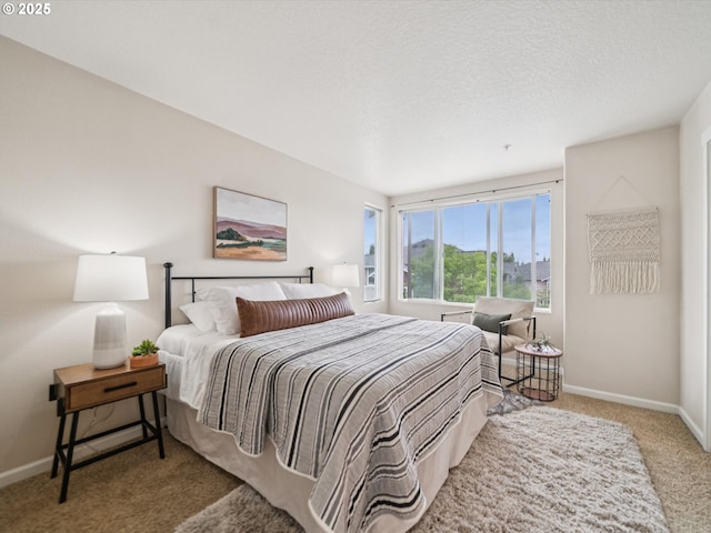 8710 SW 147th Ter Unit 104, Beaverton, OR 97007 - bedroom featuring carpet flooring and baseboards