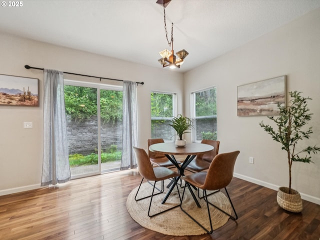 8710 SW 147th Ter Unit 104, Beaverton, OR 97007 - dining area featuring plenty of natural light, wood finished floors, and a chandelier