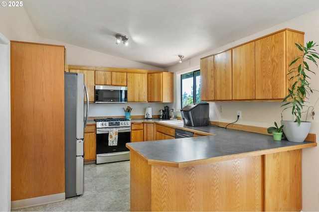 kitchen with appliances with stainless steel finishes, lofted ceiling, a peninsula, a kitchen breakfast bar, and light flooring