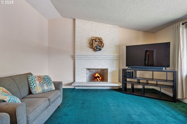 living area featuring carpet floors, a textured ceiling, lofted ceiling, and a brick fireplace