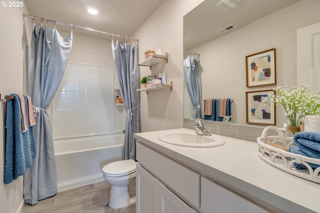 2969 U St, Springfield, OR 97477 - bathroom featuring vanity, shower / bathtub combination with curtain, toilet, and wood finished floors