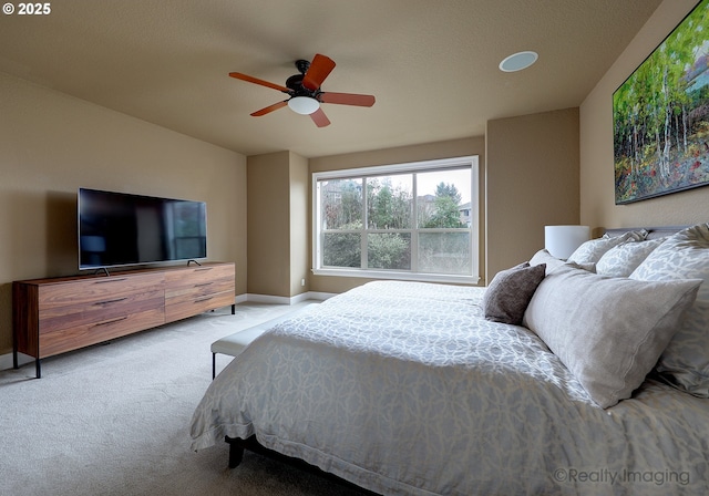 carpeted bedroom with ceiling fan