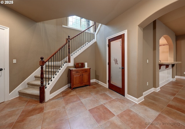 foyer with light tile patterned floors