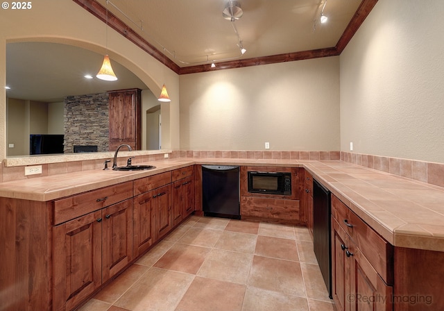 kitchen with sink, decorative light fixtures, ornamental molding, kitchen peninsula, and black appliances