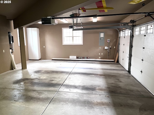 garage featuring a garage door opener and electric panel