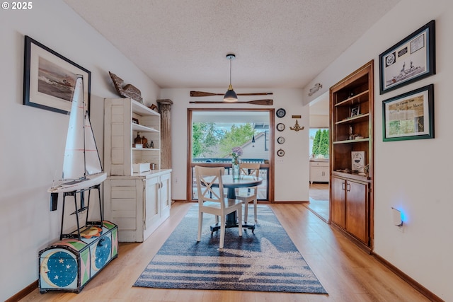 12520 SW Prince Albert St, King City, OR 97224 - dining space featuring a textured ceiling, healthy amount of natural light, light wood-type flooring, and ceiling fan