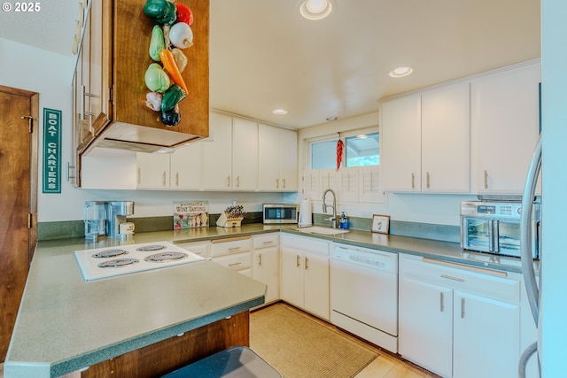 12520 SW Prince Albert St, King City, OR 97224 - kitchen with white appliances, white cabinets, and recessed lighting