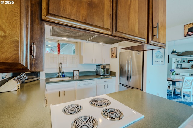 12520 SW Prince Albert St, King City, OR 97224 - kitchen featuring stainless steel appliances, white cabinets, and dark countertops