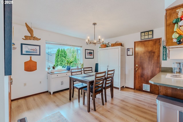 12520 SW Prince Albert St, King City, OR 97224 - dining space with a chandelier and light wood-type flooring