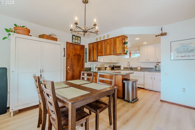 12520 SW Prince Albert St, King City, OR 97224 - dining area with light wood-style flooring, a chandelier, and recessed lighting