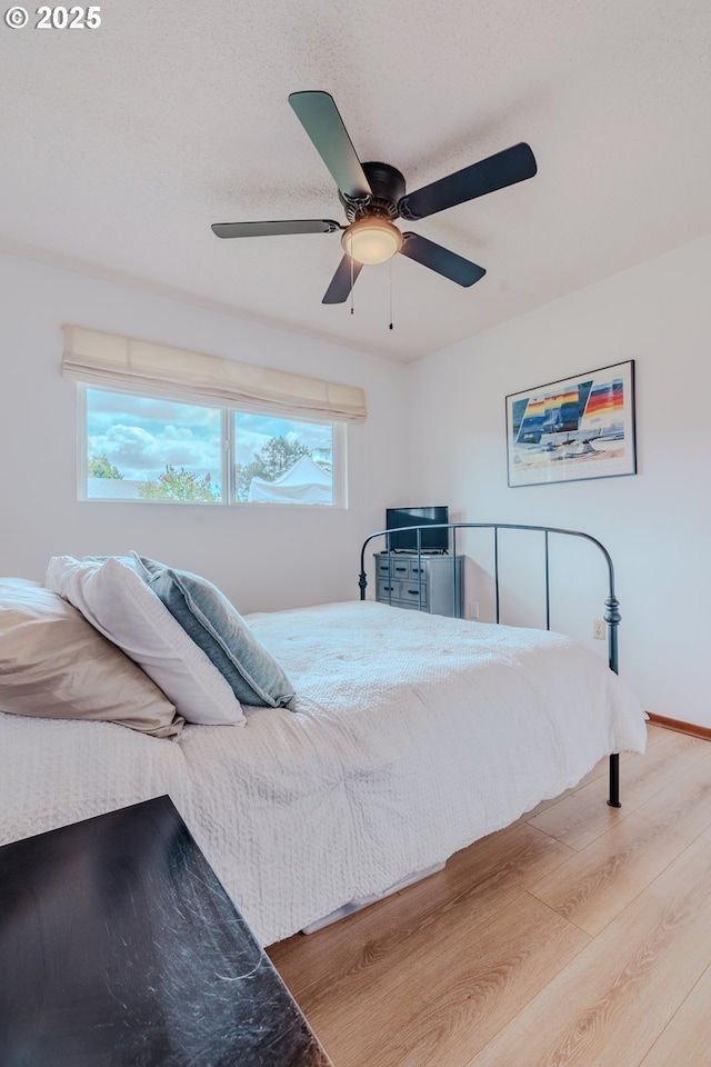 12520 SW Prince Albert St, King City, OR 97224 - bedroom with wood finished floors and a ceiling fan