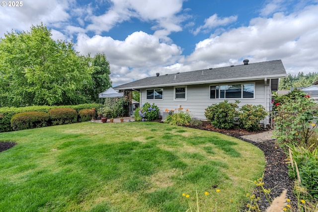12520 SW Prince Albert St, King City, OR 97224 - rear view of house with a lawn