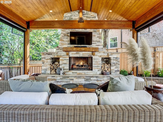 view of patio with a gazebo, an outdoor living space with a fireplace, and fence