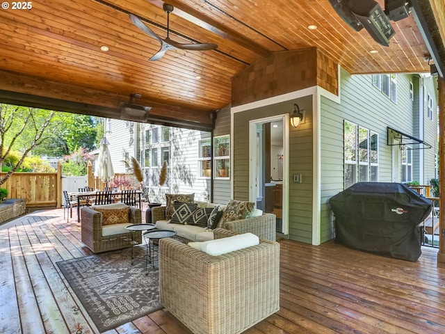 wooden deck featuring fence, an outdoor living space, a ceiling fan, and a grill
