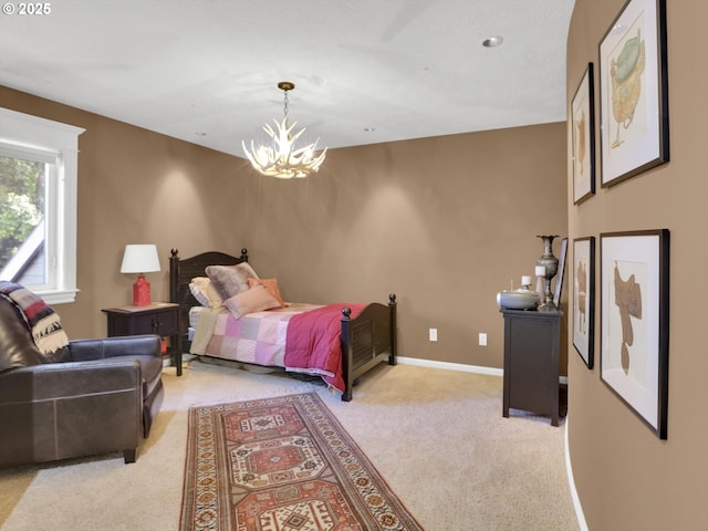 bedroom with baseboards, light carpet, and a chandelier