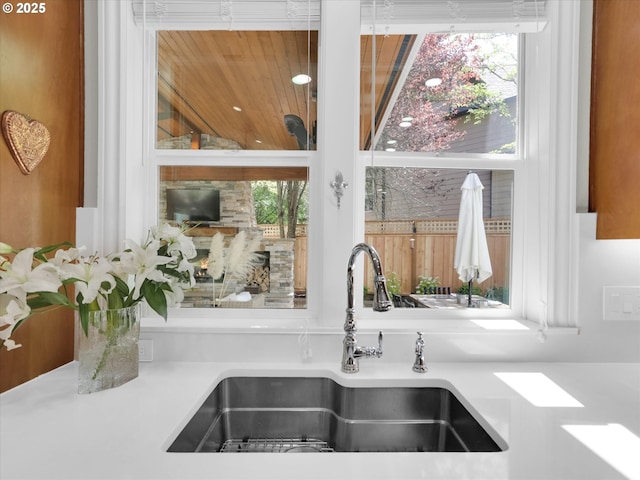 interior details featuring a sink and light countertops
