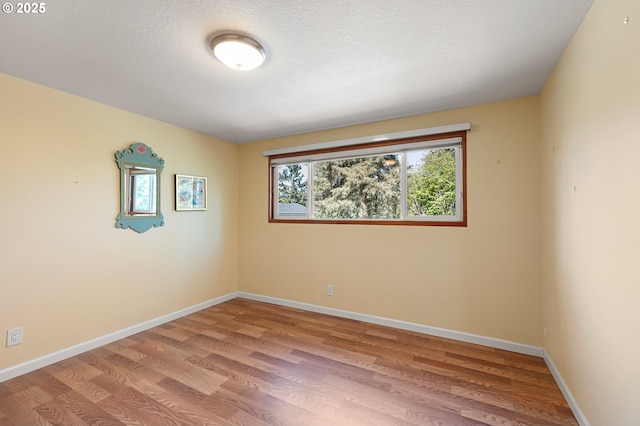 536 Kingswood Ave, Eugene, OR 97405 - empty room with a textured ceiling, baseboards, and light wood-style floors