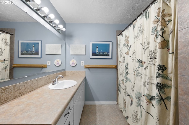 536 Kingswood Ave, Eugene, OR 97405 - bathroom with a shower with curtain, a textured ceiling, tile patterned flooring, vanity, and baseboards