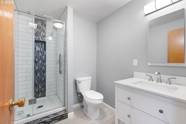 536 Kingswood Ave, Eugene, OR 97405 - bathroom featuring vanity, a shower stall, toilet, and wood finished floors