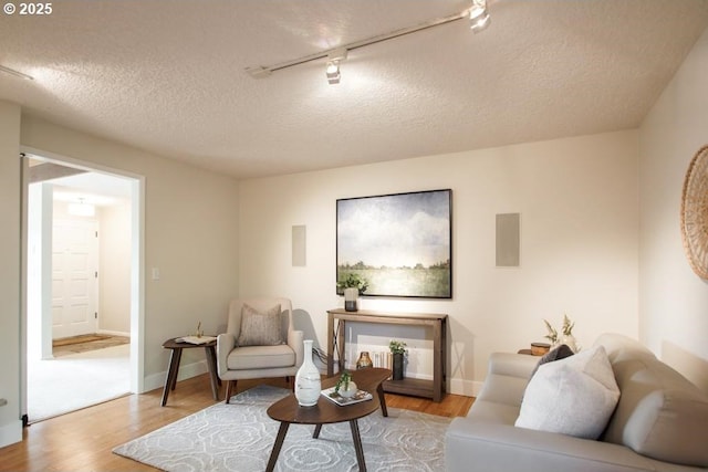 2440 SW Burbank Ave, Portland, OR 97225 - living area with track lighting and wood finished floors