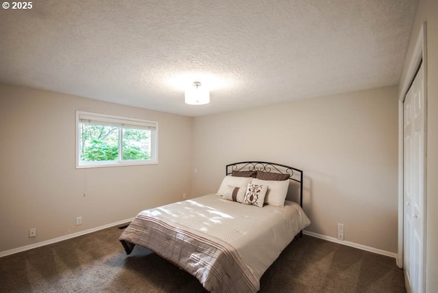 2440 SW Burbank Ave, Portland, OR 97225 - bedroom with carpet floors, a textured ceiling, and a closet