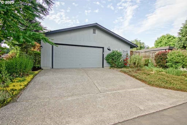 2440 SW Burbank Ave, Portland, OR 97225 - view of property exterior featuring driveway and an attached garage