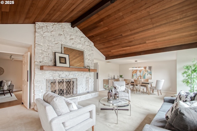 2440 SW Burbank Ave, Portland, OR 97225 - living area featuring wooden ceiling, carpet flooring, and a stone fireplace
