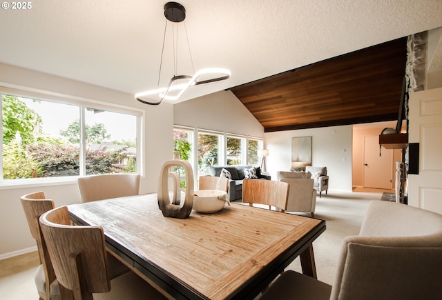 2440 SW Burbank Ave, Portland, OR 97225 - dining space with light colored carpet and vaulted ceiling