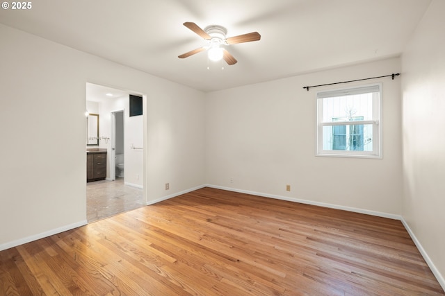 unfurnished room featuring ceiling fan and light hardwood / wood-style flooring