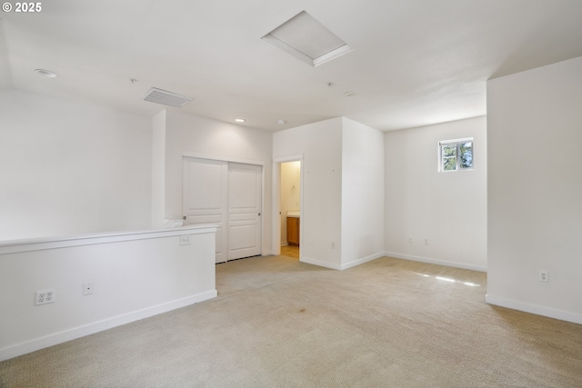 8329 SW 24th Ave, Portland, OR 97219 - spare room featuring light colored carpet, baseboards, attic access, and recessed lighting