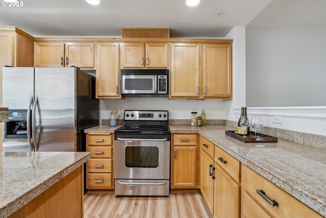 8329 SW 24th Ave, Portland, OR 97219 - kitchen featuring stainless steel appliances, tile counters, light wood-type flooring, recessed lighting, and light brown cabinets