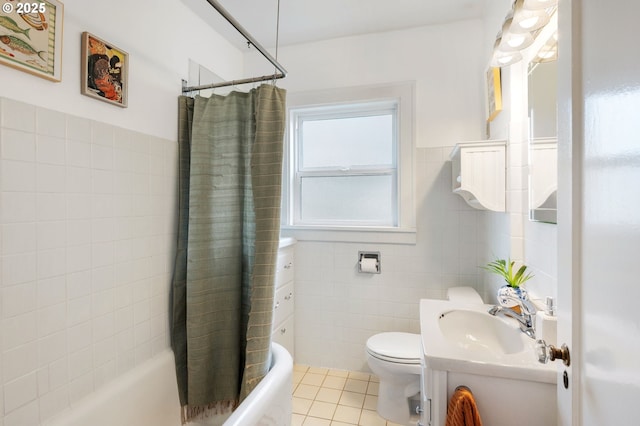 bathroom featuring vanity, tile patterned floors, tile walls, toilet, and shower / tub combo with curtain