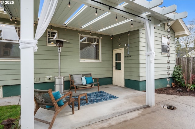 view of patio featuring fence