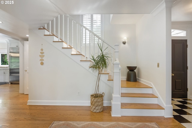 stairs featuring baseboards, recessed lighting, and wood finished floors