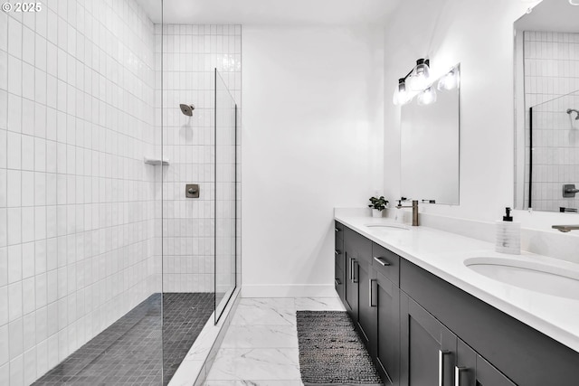 bathroom featuring vanity and a tile shower