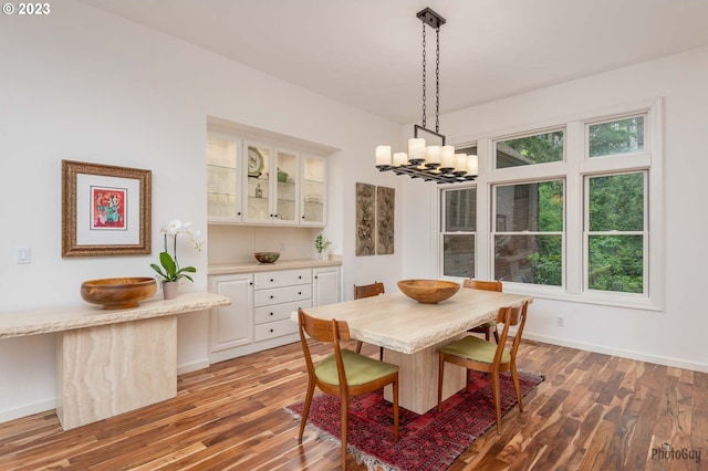 46769 Goodpasture Rd, Vida, OR 97488 - dining area featuring light wood finished floors, a notable chandelier, and baseboards
