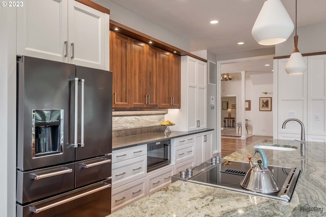 46769 Goodpasture Rd, Vida, OR 97488 - kitchen featuring white cabinetry, recessed lighting, a sink, decorative backsplash, and high end fridge