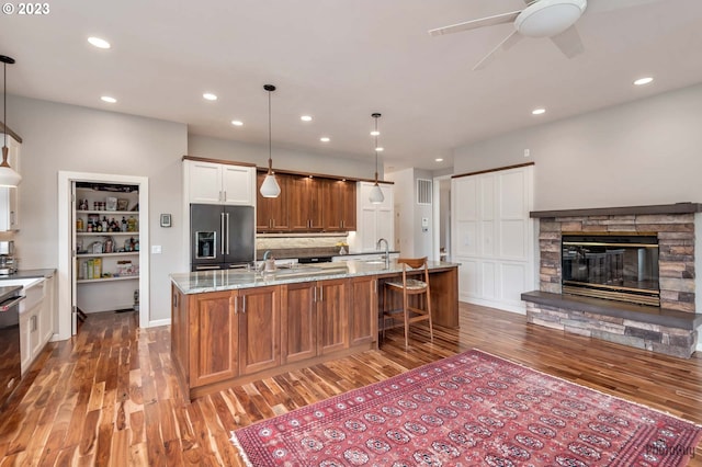 46769 Goodpasture Rd, Vida, OR 97488 - kitchen featuring high end fridge, recessed lighting, a ceiling fan, light stone countertops, and light wood finished floors