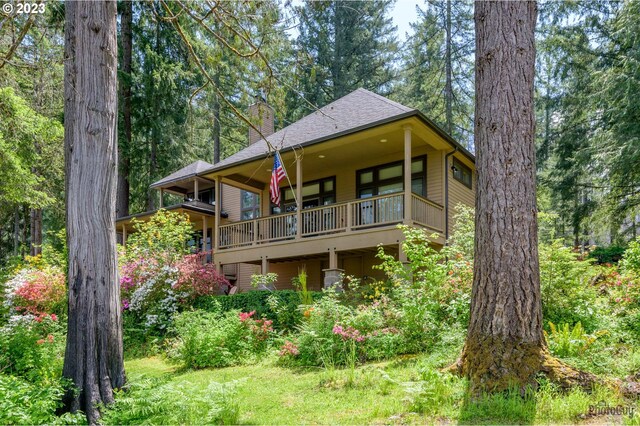 46769 Goodpasture Rd, Vida, OR 97488 - back of property featuring roof with shingles, a chimney, and a lawn